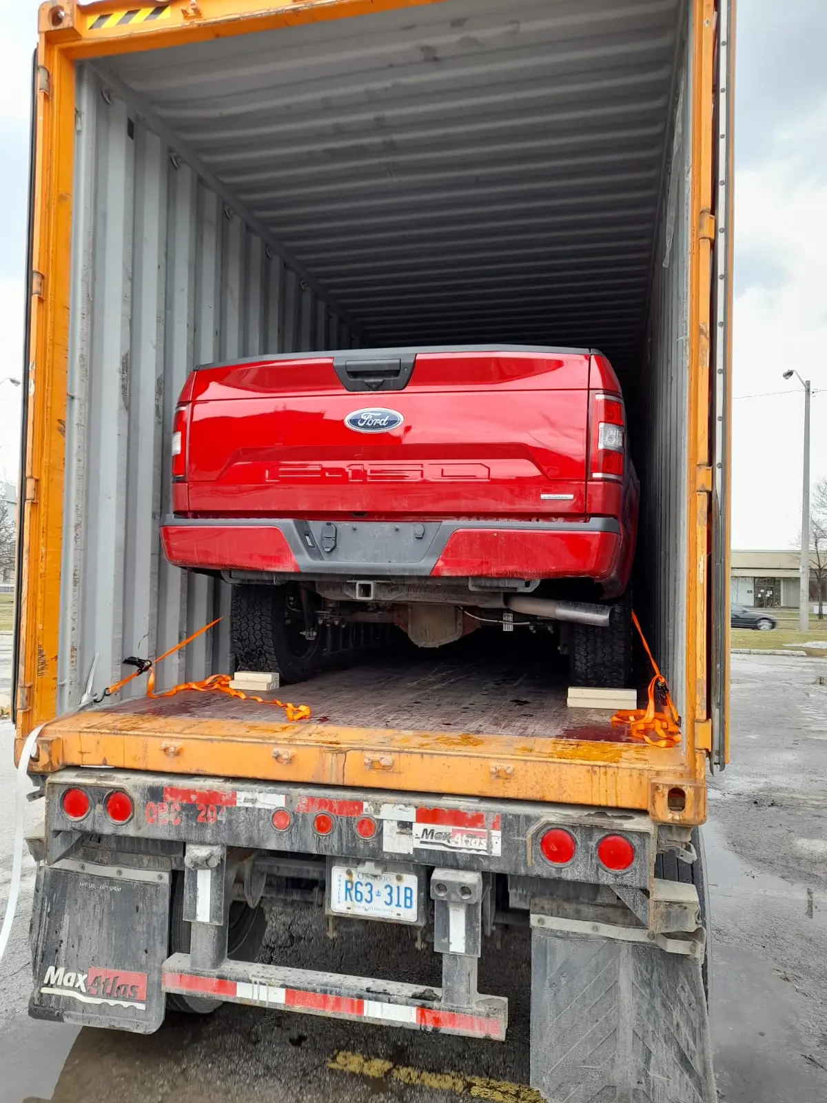 Vehicle secured inside a shipping container